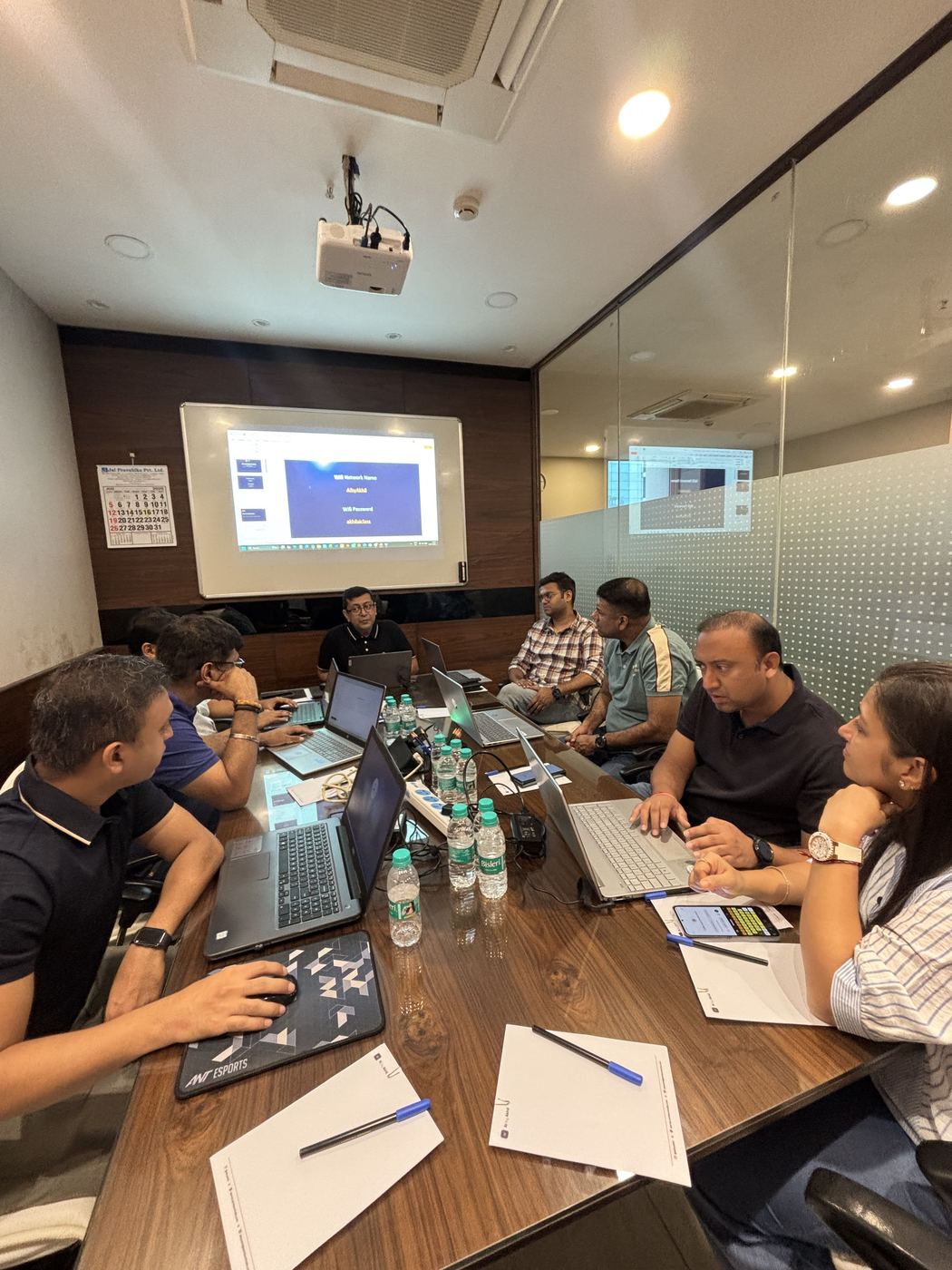 The full room during a session, everyone on their own device